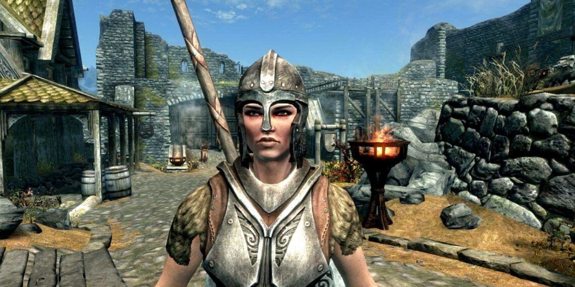 Lydia from Skyrim stood in the street in Whiterun.